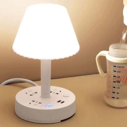 Lámpara de mesa con puerto USB y toma de corriente